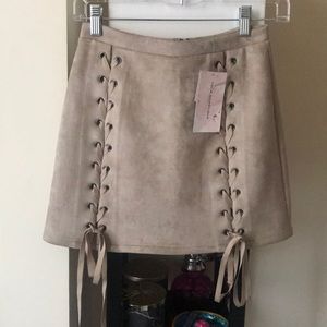 Nude Faux suede lace up mini skirt